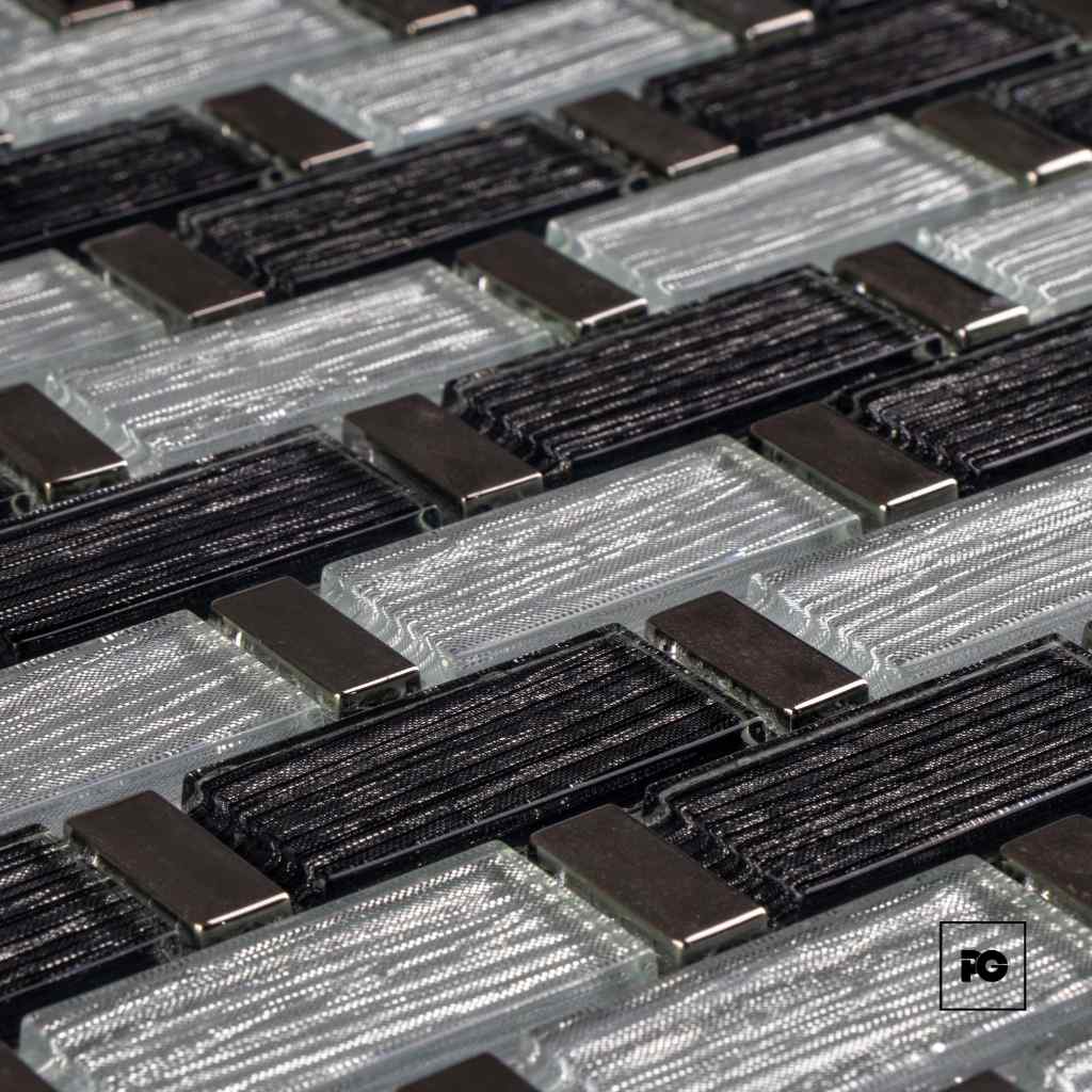 Close-up of numerous rectangular electrical connectors with braided wires and metal caps in a grid.