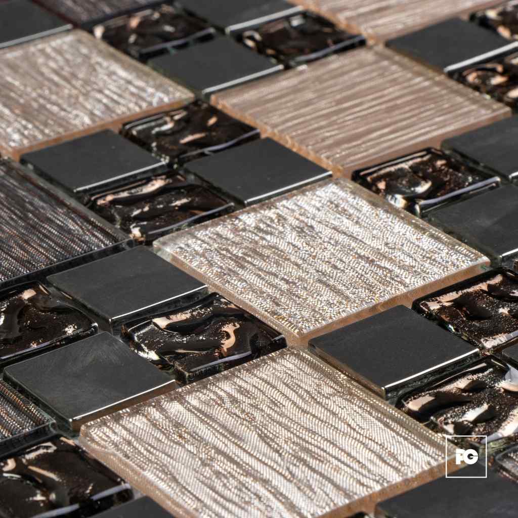Close-up of square chocolate bars arranged in a grid with glossy melted centers.