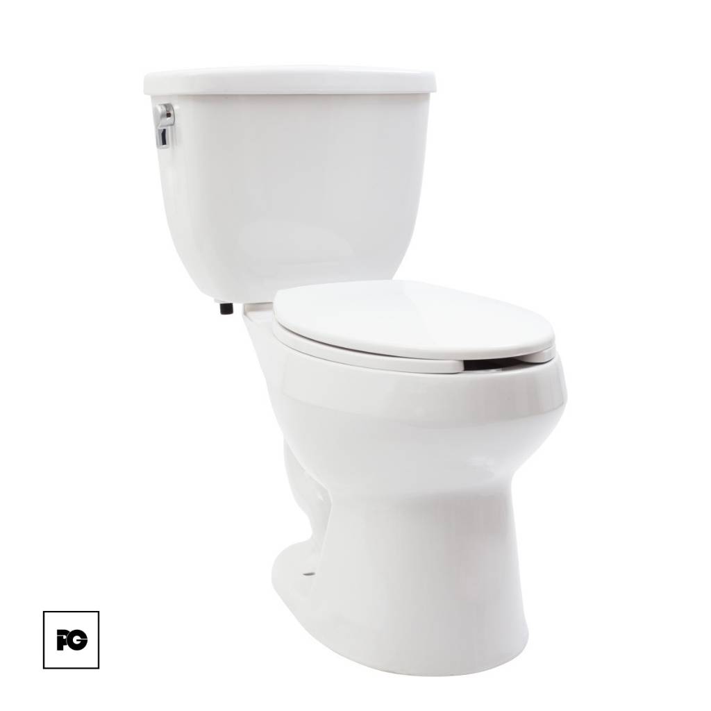 White ceramic toilet with closed lid and tank